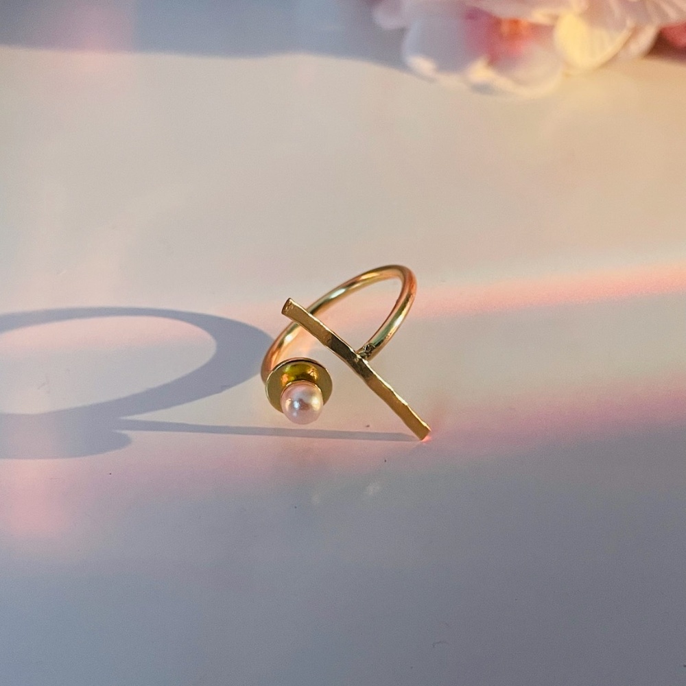 "Artistry in gold and pearls, a designer ring that exudes elegance from Rang